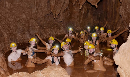 Mud bath in Dark Cave Quang Binh Vietnam